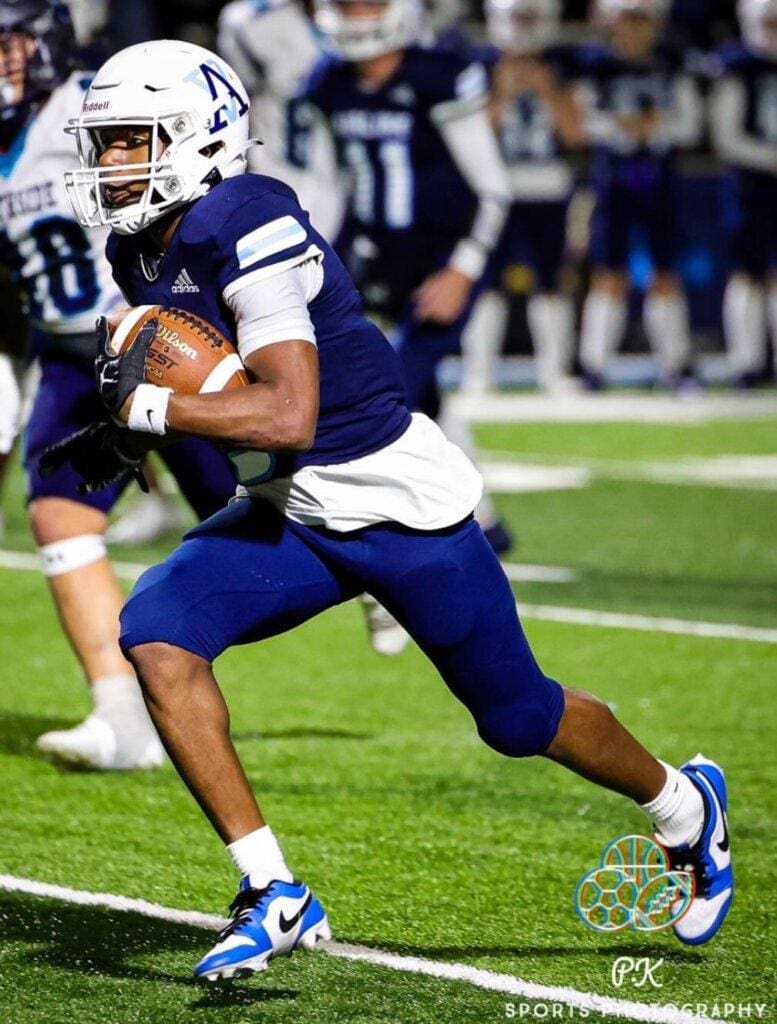 Football player running with the ball.